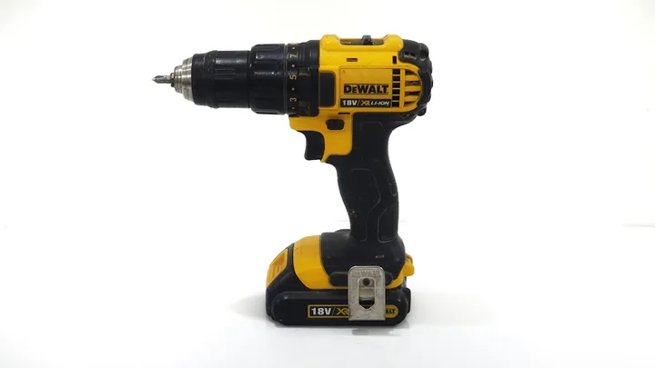 A homeowner deciding between DIY tools and calling a handyman for a home repair