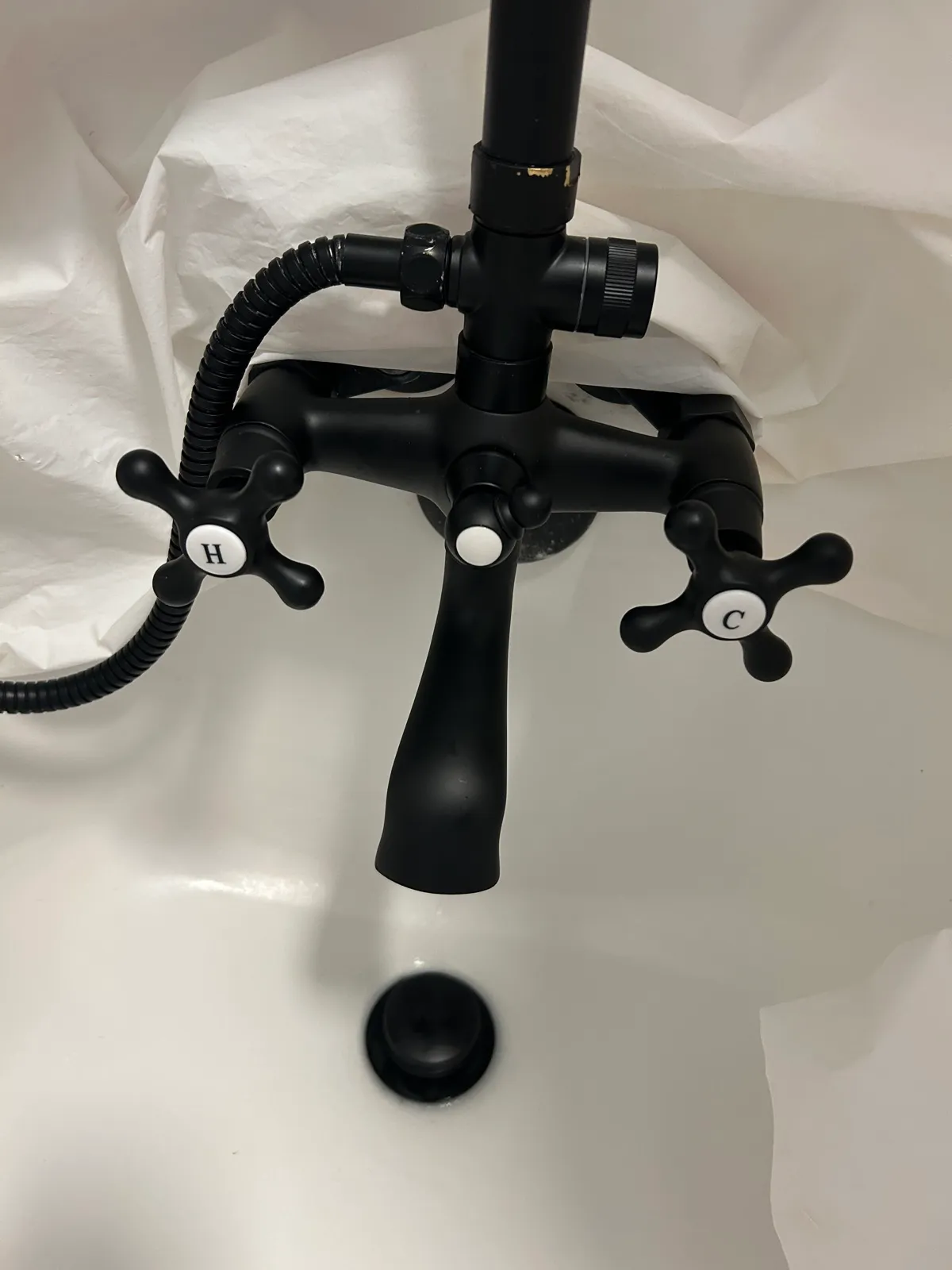 New black bathtub faucet and fixture installed clean and leak-free